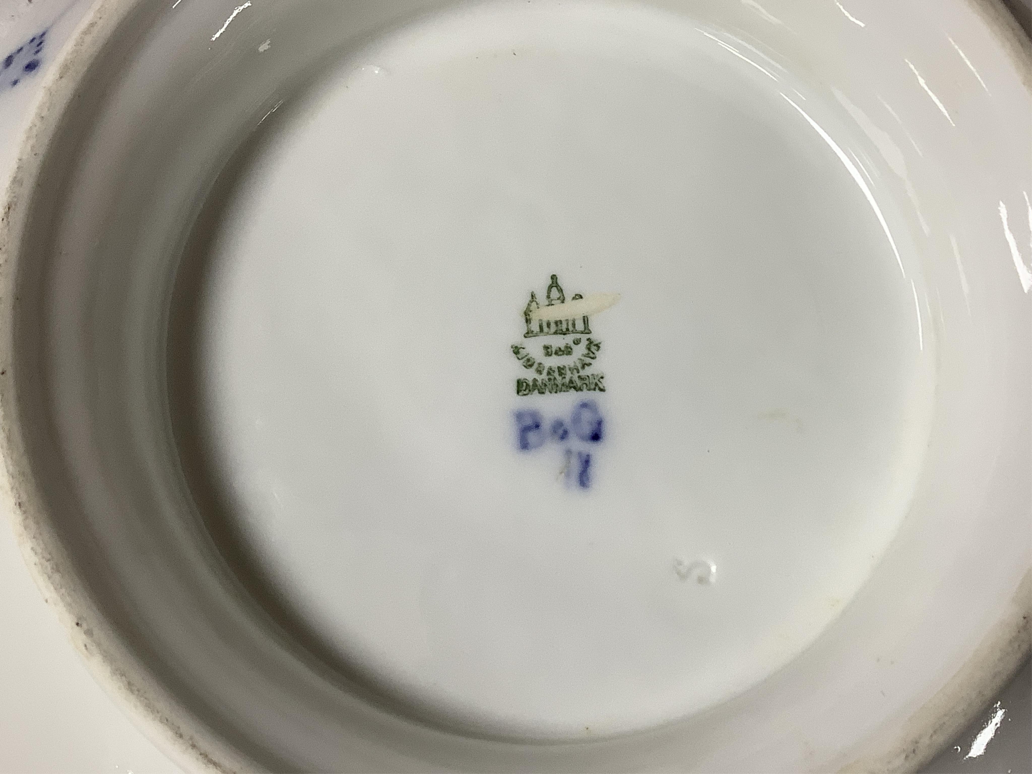 A collection of Royal Copenhagen and Bing & Grondahl onion pattern blue and white tableware